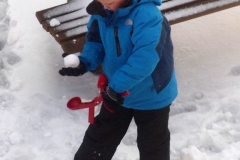 December 17,2020   Snow Storm hits New York City. Kids playing in the snow and adultsshoveling snow and cleaning off cars.