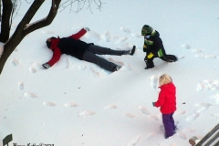 December 17,2020   Children playing outside after Snow Storm hits New York City. Children are having a brief respite from Covid 19 Pandemic with snowball fights and making snow angels and making snowmen.