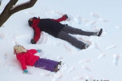 December 17,2020   Children playing outside after Snow Storm hits New York City. Children are having a brief respite from Covid 19 Pandemic with snowball fights and making snow angels and making snowmen.