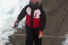 December 17,2020   Children playing outside after Snow Storm hits New York City. Children are having a brief respite from Covid 19 Pandemic with snowball fights and making snow angels and making snowmen.