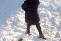 December 17,2020   Children playing outside after Snow Storm hits New York City. Children are having a brief respite from Covid 19 Pandemic with snowball fights and making snow angels and making snowmen.