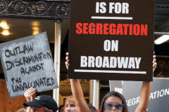 "Springsteen on Broadway" opened tonight for a return to Broadway at the St. James Theater, the first event on a Broadway stage since the Pandemic. Protestors outside were against the vaccine and having to show proof in order tone able to see the show. Springsteen was rushed in a back entrance to avoid the protestors in New York City on 26 June 2021