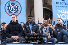 The New York City FC team listens to speakers at the NYCFC 2021 MLS Cup Championship celebration at City Hall in New York, New York, on Dec. 14,  2021. (Photo by Gabriele Holtermann/Sipa USA)