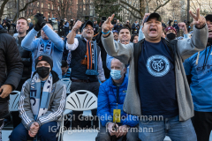 New York City FC fans celebrate the NYCFC 2021 MLS Cup Championship at City Hall in New York, New York, on Dec. 14,  2021. (Photo by Gabriele Holtermann/Sipa USA)