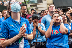 A young woman can't watch the penalty kicks as a few hundred Italy fans cheer on their Azzurri in the Euro Cup 2020 final against England outside Ribalta Italian restaurant on E12th Street in New York City on July 11, 2021. Italy beat the Three Lions 3-2 on penalties after a 1-1 draw. (Photo by Gabriele Holtermann/Sipa USA)