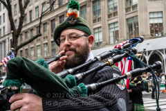 A bagpiper plays tunes for the crowd that gathered for the St. Patrick's Day Parade in New York, New York, on Mar. 17, 2022.  (Photo by Gabriele Holtermann/Sipa USA)