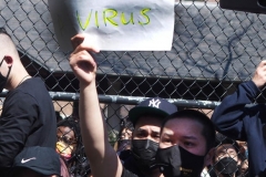 Members and supporters of the Asian-American community attend a "rally against hate" at Columbus Park in New York City on 21 March 2021. Three massage parlors around Atlanta were targeted March 16, 2021, and a 21-year-old suspect was arrested. Robert Aaron Long faces eight counts of murder and one charge of aggravated assault.