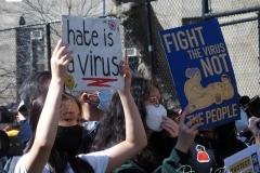 Members and supporters of the Asian-American community attend a "rally against hate" at Columbus Park in New York City. Three massage parlors around Atlanta were targeted March 16, 2021, and a 21-year-old suspect was arrested. Robert Aaron Long faces eight counts of murder and one charge of aggravated assault.