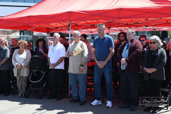 Street Naming
Lilac Court and Forest Avenue
Mariners Harbor
Staten Island, NY
April 22, 2022
Photographs by Mary DiBiase Blaich

The interaction of Lilac Court and Forest Avenue was renamed in a ceremony on Friday, April 22, 2022 for Nicholas M Troianiello, a World War II veteran of the Battle of Iwo Jima who served with the Marines.  Upon returning from service, he joined the FDNY and rose to the rank of Lieutenant, serving in Ladder 15 in Manhattan. He was a Purple Heart recipient.
At the ceremony, many groups gathered to honor Mr Troianiello including The Marine Corps League, the FDNY Retirees Association and current members of the FDNY.  Also in attendance were Congresswoman Nicole Malliotakis; Boro President Vito Fossella;  City Councilwoman Kamillah Hanks and two color guards: Marines 6th Communication Battalion and the FDNY Ceremonial Unit.  The Marine Corps League gave a 21 gun salute, and Frank Montella played Taps.  Carmella Montella needed a box to reach the microphone as she delivered the Invocation.