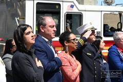 Street Naming
Lilac Court and Forest Avenue
Mariners Harbor
Staten Island, NY
April 22, 2022
Photographs by Mary DiBiase Blaich

The interaction of Lilac Court and Forest Avenue was renamed in a ceremony on Friday, April 22, 2022 for Nicholas M Troianiello, a World War II veteran of the Battle of Iwo Jima who served with the Marines.  Upon returning from service, he joined the FDNY and rose to the rank of Lieutenant, serving in Ladder 15 in Manhattan. He was a Purple Heart recipient.
At the ceremony, many groups gathered to honor Mr Troianiello including The Marine Corps League, the FDNY Retirees Association and current members of the FDNY.  Also in attendance were Congresswoman Nicole Malliotakis; Boro President Vito Fossella;  City Councilwoman Kamillah Hanks and two color guards: Marines 6th Communication Battalion and the FDNY Ceremonial Unit.  The Marine Corps League gave a 21 gun salute, and Frank Montella played Taps.  Carmella Montella needed a box to reach the microphone as she delivered the Invocation.