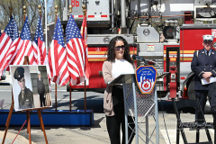 Street Naming
Lilac Court and Forest Avenue
Mariners Harbor
Staten Island, NY
April 22, 2022
Photographs by Mary DiBiase Blaich

The interaction of Lilac Court and Forest Avenue was renamed in a ceremony on Friday, April 22, 2022 for Nicholas M Troianiello, a World War II veteran of the Battle of Iwo Jima who served with the Marines.  Upon returning from service, he joined the FDNY and rose to the rank of Lieutenant, serving in Ladder 15 in Manhattan. He was a Purple Heart recipient.
At the ceremony, many groups gathered to honor Mr Troianiello including The Marine Corps League, the FDNY Retirees Association and current members of the FDNY.  Also in attendance were Congresswoman Nicole Malliotakis; Boro President Vito Fossella;  City Councilwoman Kamillah Hanks and two color guards: Marines 6th Communication Battalion and the FDNY Ceremonial Unit.  The Marine Corps League gave a 21 gun salute, and Frank Montella played Taps.  Carmella Montella needed a box to reach the microphone as she delivered the Invocation.