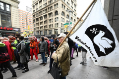 Members of Extinction Rebellion (XR) marked Tax Day with the "No Wars, No Warming" demonstration outside a federal building in NYC where Internal Revenue Service (IRS) have offices "to demand that our tax money stop being used to fund endless war and environmental destruction”, on April 18, 2022 (Photo by Slaven Vlasic)