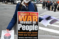 Members of Extinction Rebellion (XR) marked Tax Day with the "No Wars, No Warming" demonstration outside a federal building in NYC where Internal Revenue Service (IRS) have offices "to demand that our tax money stop being used to fund endless war and environmental destruction”, on April 18, 2022 (Photo by Slaven Vlasic)
