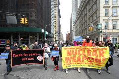 Members of Extinction Rebellion (XR) marked Tax Day with the "No Wars, No Warming" demonstration outside a federal building in NYC where Internal Revenue Service (IRS) have offices "to demand that our tax money stop being used to fund endless war and environmental destruction”, on April 18, 2022 (Photo by Slaven Vlasic)
