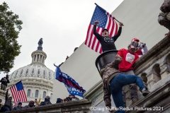 Dozens, from among thousands of supporters of President Donald Trump storm the United States Capitol in Washington, D.C., Wednesday, Jan. 6, 2020, as they protest the electoral college certification of President-Elect Joe Biden.