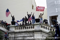 Supporters of President Donald Trump hold their ground after storming the United States Capitol in Washington, D.C., Wednesday, Jan. 6, 2020, as they protest the electoral college certification of President-Elect Joe Biden.