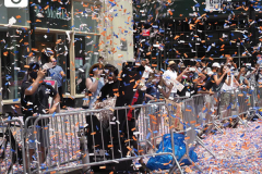 Confetti flies through the air to honor essential workers during the Hometown Heroes Ticker-tape Parade along the Canyon of Heroes on July 7, 2021 in New York. The parade included a variety of different floats, representing the groups of essential workers who served this city heroically throughout the pandemic.