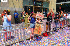 Confetti flies thru the air as essential workers are honored during the Hometown Heroes Ticker-tape Parade along the Canyon of Heroes on July 7, 2021 in New York. The parade included a variety of different floats, representing the groups of essential workers who served this city heroically throughout the pandemic.