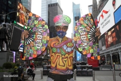New York City. "The Crossroads of the World" 
Times Square. Andy Golub Artist/Founder of Human Connection Arts paints 3 models in Times square, as onlookers watch and street performers and costume characters entertain
vistors.