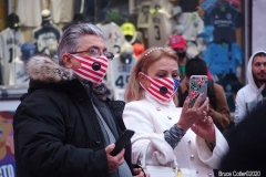 New York City. "The Crossroads of the World" Times Square. Andy Golub Artist/Founder of Human Connection Arts paints 3 models in Times square, as onlookers watch and street performers and costume characters entertainvistors.