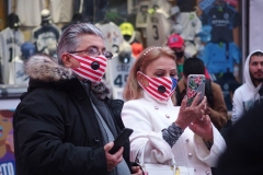 New York City. "The Crossroads of the World" Times Square. Andy Golub Artist/Founder of Human Connection Arts paints 3 models in Times square, as onlookers watch and street performers and costume characters entertainvistors.