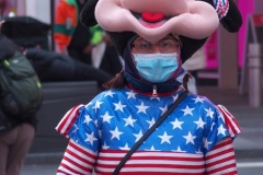 New York City. "The Crossroads of the World" Times Square. Andy Golub Artist/Founder of Human Connection Arts paints 3 models in Times square, as onlookers watch and street performers and costume characters entertainvistors.