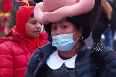 New York City. "The Crossroads of the World" Times Square. Andy Golub Artist/Founder of Human Connection Arts paints 3 models in Times square, as onlookers watch and street performers and costume characters entertainvistors.