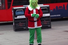 New York City. "The Crossroads of the World" Times Square. Andy Golub Artist/Founder of Human Connection Arts paints 3 models in Times square, as onlookers watch and street performers and costume characters entertainvistors.
