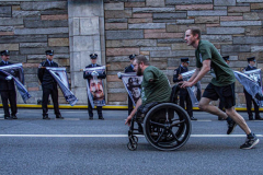 The Tunnel to Tower 5k run and walk in NYC filled with runners of all kinds to commemorate the run on 9/11 of Fireman Stephen Siller from Brooklyn to Manhattan through the Hugh L. Carey tunnel.
The run pays tribute to the 343 FDNY firefighters, 71 law enforcement officers and thousands of civilians who lost their lives on that catastrophic day 20 years ago. All proceeds to the event go to supporting those of first responders and injured service members. 
Service members adorned with images of those lost and holding flags lined the streets in support of the runners as they passed through the tunnel and ran their way through lower Manhattan to the finish line. (C) Bianca Otero, September 26, 2021
