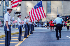 The Tunnel to Tower 5k run and walk in NYC filled with runners of all kinds to commemorate the run on 9/11 of Fireman Stephen Siller from Brooklyn to Manhattan through the Hugh L. Carey tunnel.
The run pays tribute to the 343 FDNY firefighters, 71 law enforcement officers and thousands of civilians who lost their lives on that catastrophic day 20 years ago. All proceeds to the event go to supporting those of first responders and injured service members. 
Service members adorned with images of those lost and holding flags lined the streets in support of the runners as they passed through the tunnel and ran their way through lower Manhattan to the finish line. (C) Bianca Otero, September 26, 2021