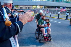 The Tunnel to Tower 5k run and walk in NYC filled with runners of all kinds to commemorate the run on 9/11 of Fireman Stephen Siller from Brooklyn to Manhattan through the Hugh L. Carey tunnel.
The run pays tribute to the 343 FDNY firefighters, 71 law enforcement officers and thousands of civilians who lost their lives on that catastrophic day 20 years ago. All proceeds to the event go to supporting those of first responders and injured service members. 
Service members adorned with images of those lost and holding flags lined the streets in support of the runners as they passed through the tunnel and ran their way through lower Manhattan to the finish line. (C) Bianca Otero, September 26, 2021