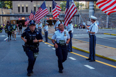 The Tunnel to Tower 5k run and walk in NYC filled with runners of all kinds to commemorate the run on 9/11 of Fireman Stephen Siller from Brooklyn to Manhattan through the Hugh L. Carey tunnel.
The run pays tribute to the 343 FDNY firefighters, 71 law enforcement officers and thousands of civilians who lost their lives on that catastrophic day 20 years ago. All proceeds to the event go to supporting those of first responders and injured service members. 
Service members adorned with images of those lost and holding flags lined the streets in support of the runners as they passed through the tunnel and ran their way through lower Manhattan to the finish line. (C) Bianca Otero, September 26, 2021