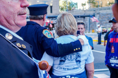 The Tunnel to Tower 5k run and walk in NYC filled with runners of all kinds to commemorate the run on 9/11 of Fireman Stephen Siller from Brooklyn to Manhattan through the Hugh L. Carey tunnel.
The run pays tribute to the 343 FDNY firefighters, 71 law enforcement officers and thousands of civilians who lost their lives on that catastrophic day 20 years ago. All proceeds to the event go to supporting those of first responders and injured service members. 
Service members adorned with images of those lost and holding flags lined the streets in support of the runners as they passed through the tunnel and ran their way through lower Manhattan to the finish line. (C) Bianca Otero, September 26, 2021