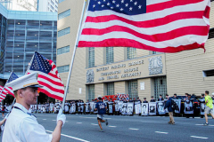 The Tunnel to Tower 5k run and walk in NYC filled with runners of all kinds to commemorate the run on 9/11 of Fireman Stephen Siller from Brooklyn to Manhattan through the Hugh L. Carey tunnel.
The run pays tribute to the 343 FDNY firefighters, 71 law enforcement officers and thousands of civilians who lost their lives on that catastrophic day 20 years ago. All proceeds to the event go to supporting those of first responders and injured service members. 
Service members adorned with images of those lost and holding flags lined the streets in support of the runners as they passed through the tunnel and ran their way through lower Manhattan to the finish line. (C) Bianca Otero, September 26, 2021