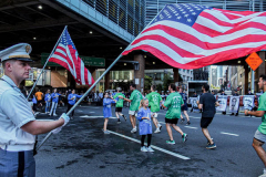 The Tunnel to Tower 5k run and walk in NYC filled with runners of all kinds to commemorate the run on 9/11 of Fireman Stephen Siller from Brooklyn to Manhattan through the Hugh L. Carey tunnel.
The run pays tribute to the 343 FDNY firefighters, 71 law enforcement officers and thousands of civilians who lost their lives on that catastrophic day 20 years ago. All proceeds to the event go to supporting those of first responders and injured service members. 
Service members adorned with images of those lost and holding flags lined the streets in support of the runners as they passed through the tunnel and ran their way through lower Manhattan to the finish line. (C) Bianca Otero, September 26, 2021