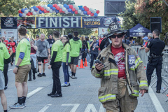 The Tunnel to Tower 5k run and walk in NYC filled with runners of all kinds to commemorate the run on 9/11 of Fireman Stephen Siller from Brooklyn to Manhattan through the Hugh L. Carey tunnel.
The run pays tribute to the 343 FDNY firefighters, 71 law enforcement officers and thousands of civilians who lost their lives on that catastrophic day 20 years ago. All proceeds to the event go to supporting those of first responders and injured service members. 
Service members adorned with images of those lost and holding flags lined the streets in support of the runners as they passed through the tunnel and ran their way through lower Manhattan to the finish line. (C) Bianca Otero, September 26, 2021