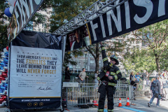 The Tunnel to Tower 5k run and walk in NYC filled with runners of all kinds to commemorate the run on 9/11 of Fireman Stephen Siller from Brooklyn to Manhattan through the Hugh L. Carey tunnel.
The run pays tribute to the 343 FDNY firefighters, 71 law enforcement officers and thousands of civilians who lost their lives on that catastrophic day 20 years ago. All proceeds to the event go to supporting those of first responders and injured service members. 
Service members adorned with images of those lost and holding flags lined the streets in support of the runners as they passed through the tunnel and ran their way through lower Manhattan to the finish line. (C) Bianca Otero, September 26, 2021