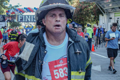 The Tunnel to Tower 5k run and walk in NYC filled with runners of all kinds to commemorate the run on 9/11 of Fireman Stephen Siller from Brooklyn to Manhattan through the Hugh L. Carey tunnel.
The run pays tribute to the 343 FDNY firefighters, 71 law enforcement officers and thousands of civilians who lost their lives on that catastrophic day 20 years ago. All proceeds to the event go to supporting those of first responders and injured service members. 
Service members adorned with images of those lost and holding flags lined the streets in support of the runners as they passed through the tunnel and ran their way through lower Manhattan to the finish line. (C) Bianca Otero, September 26, 2021
