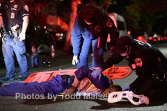 An unidentified man delivering food to a local household in Canarsie, Brooklyn, was struck on his motorized bike by a BMW driver as he rode down East 84th Street near Flatlands Avenue Tuesday night. He man was left unconscious after suffering a head injury. He was rushed to Brookdale Hospital in critical condition. The driver remained on the scene as police investigated the crash. (Photos by Todd Maisel)