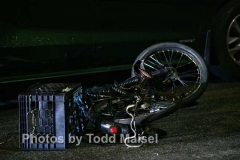 An unidentified man delivering food to a local household in Canarsie, Brooklyn, was struck on his motorized bike by a BMW driver as he rode down East 84th Street near Flatlands Avenue Tuesday night. He man was left unconscious after suffering a head injury. He was rushed to Brookdale Hospital in critical condition. The driver remained on the scene as police investigated the crash. (Photos by Todd Maisel)