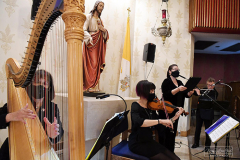 UND Eve of Remembrance Ceremony
Our Lady of Pity Church
Staten Island, NY
Photographs by:  Mary DiBiase Blaich

The 20th Annual Solemn Remembrance of 9/11 was held at the Church of Our Lady of Pity on Friday, September 10, 2021.  The evening is sponsored by University of Notre Dame  Alumni Club of Staten Island.  The evening began with 30 minutes of music by the Maura Molloy Group.  A con celebrated Mass began at 7:30, and Bishop John O’Hara was the main celebrant and homilist.  Many priests and deacons attended the event. 
 An honor guard was provided by the Knights of Columbus, and the Holy Name Society of St Anthony of Padua marched in and sat as a group.  
All the names of the Staten Island victims on 9/11 and the additional victims of 9/11 related illness were read by members of the club and students from the Island’s Catholic High Schools.  The number of victims is over 330.  
Shortly before the conclusion of the Mass,   Staten Island Pipes and Drums played “Amazing Grace” as the church was turned into darkness, with just the Altar candles burning.  
Following the service, the pipers and drummers performed more selections in the parking lot next to the parish hall.