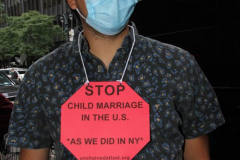 New York,   N.Y.. –Unchained At Last and advocates dressed in bridal gowns and veils, with arms chained and mouths taped, gathered in Manhattan outside Gov. Cuomo’s office to celebrate that New York just became the sixth state to end child marriage.