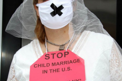 New York,   N.Y.. –Unchained At Last and advocates dressed in bridal gowns and veils, with arms chained and mouths taped, gathered in Manhattan outside Gov. Cuomo’s office to celebrate that New York just became the sixth state to end child marriage.