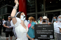 New York,   N.Y.. –Unchained At Last and advocates dressed in bridal gowns and veils, with arms chained and mouths taped, gathered in Manhattan outside Gov. Cuomo’s office to celebrate that New York just became the sixth state to end child marriage.