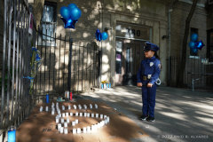 Maria Michelle, 5 stares down at the candles laid out during memorial Candlelight Vigil for NYPD Slain Officer Adrianna Reyes-Gomez. Bronx residents, NYPD officials and Bronx elected officials hold a Candlelight Vigil in honor and in memory of NYPD Transit Officer Adrianna Reyes-Gomez who was brutally murdered in her Bronx apartment at 780 Grand Concourse, Bronx, New York 10451 on Wednesday, June 15, 2022

Photography by Enid B. Alvarez