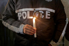 Hundreds of police officers, FDNY officers and members of the public are gathered outside the 32nd Precinct during a candlelight vigil for two officers that were shot in New York City on January 22, 2022. (Photo by Andrew Schwartz)