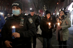 Hundreds of police officers, FDNY officers and members of the public are gathered outside the 32nd Precinct during a candlelight vigil for two officers that were shot in New York City on January 22, 2022. (Photo by Andrew Schwartz)