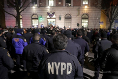 Hundreds of police officers, FDNY officers and members of the public are gathered outside the 32nd Precinct during a candlelight vigil for two officers that were shot in New York City on January 22, 2022. (Photo by Andrew Schwartz)