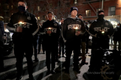 Hundreds of police officers, FDNY officers and members of the public are gathered outside the 32nd Precinct during a candlelight vigil for two officers that were shot in New York City on January 22, 2022. (Photo by Andrew Schwartz)