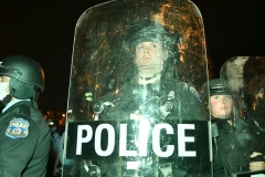 Police stand on a street corner in West Philly after a police involved shooting. (Photo by Lloyd Mitchell)